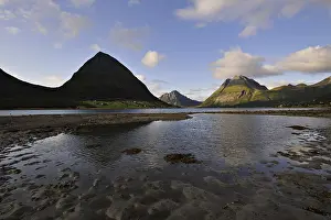 The island of Aldra with the Hjartinden peaks from the shore at Haugland