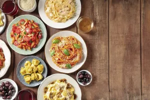 Italian pasta, various dishes, overhead flat lay shot with copy space