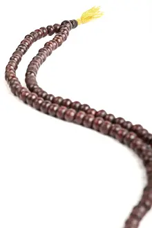 Japa Mala, Buddhist or Hindu prayer beadsi solated on white