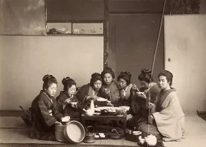 Japanese woman sharing a meal, 1900