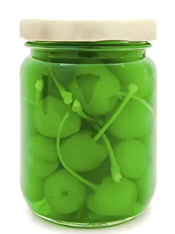Jar With Cherry Over The White Background