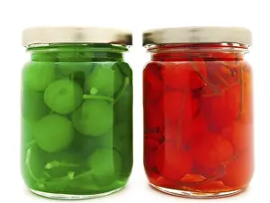 Jars With Cherry Over The White Background
