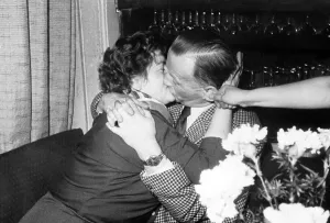 Jealousy, rival pulls kissing man on ear
