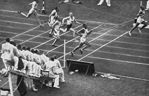 Jesse Owens tears the finish tape in the 100 m