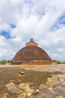 Jetavanaramaya Dagoba or stupa with damaged spire seen centered from platform corner in the ancient capitol of
