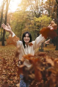 A joyful woman in a cozy sweater