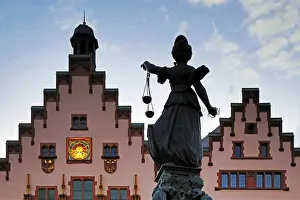 Justitia with scales, Fountain of Justice at the town hall in the evening