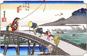 Kakegawa: Travellers crossing a high trestle-bridge over the Kake River