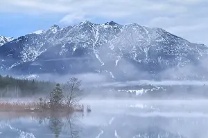 Karwendel mountains and Barmsee lake in foggy morning