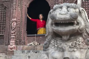 Kathmandu-18.03.2019: The women and her cat on durbar square in Kathmandu