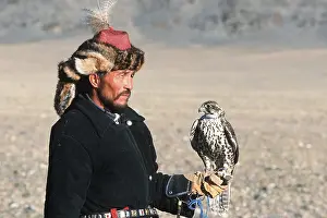 Kazakh eagle hunter with a falcon (Falco)