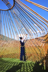 Kazakh men building a yurt, For editorial use only