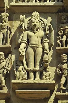 Khajuraho agni devta on wall of lakshmana temple madhya pradesh india