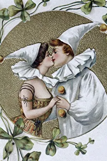 Kissing couple wearing pointed hats