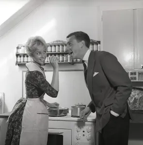 In the kitchen 1950s. A young couple in their kitchen