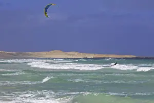 Kitesurfer, kiteboarder pulled by power kite at Rabil beach on the island Boa Vista