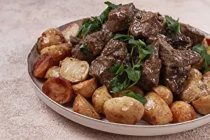 Kuyrdak, roast offal with potatoes and fresh herbs