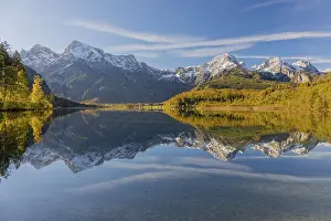 Lake Almsee in autumn with mountains reflected in the lake