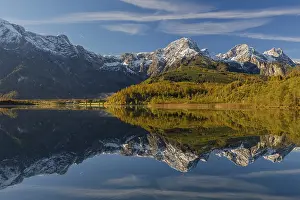 Lake Almsee in autumn with mountains reflected in the lake