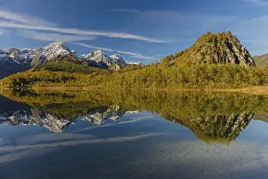 Lake Almsee in autumn with mountains reflected in the lake
