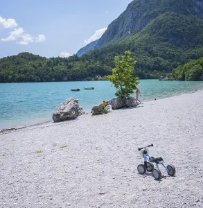 Lake Molveno is nestled between mountains in the Dolomites