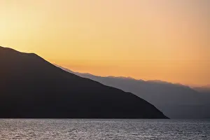 Lake and mountain landscape at sunset
