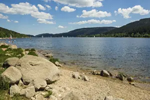 Lake in the mountains and beach in summer