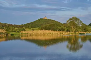 Lake in spring with castle at sunset