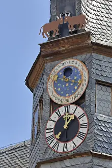Lancet turret with astronomical clock and heraldic animal of town hall
