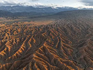 Landscape of eroded hills, badlands at sunset