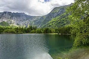Framed Print : Landscape of Lake Offensee after rain when the sun comes through the clouds in spring