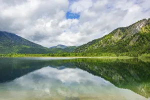Landscape of Lake Offensee after rain when the sun comes through the clouds in spring
