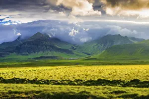 Framed Print : Landscape with meadow and mountains in the evening light