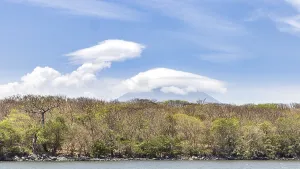 Landscape of Ometepe island with majestic volcano covered with clouds in background in southwest of Nicaragua