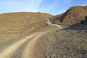 Landscape with rocky dirt road in the Altai Mountains