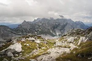 Landscape in the rocky mountains with mountain peaks in the clouds in the background