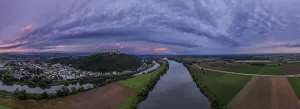 The landscape shows the wide Danube flowing through green fields (Lower Bavaria)