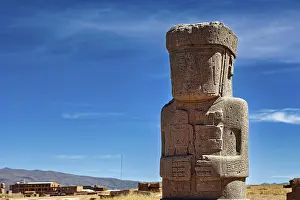 Large ancient stone statue under clear sky