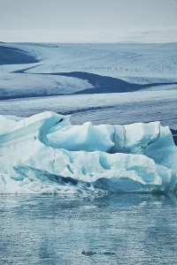 Large blue iceberg floating in cold