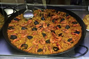 Large dish of freshly cooked seafood paella