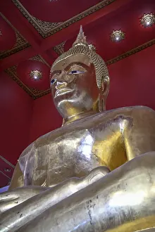 Large golden Buddha in lotus position
