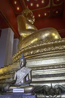 Large golden Buddha in lotus position