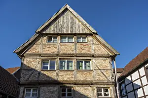 Large half-timbered house under a blue sky