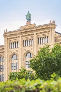 Large historic building with statue on the roof