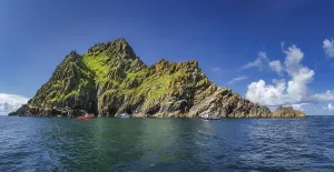 Large panorama with cruise boats docking to Skellig Michael island