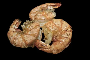 Three large, shell-fried king prawns
