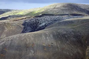 Lava on a barren mountainside, hiking trails