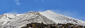 Lava scree, snow-capped peaks, blue sky