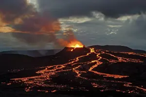 Category Mountain Landscapes Prints: Lava spurting out of crater and reddish illuminated smoke cloud