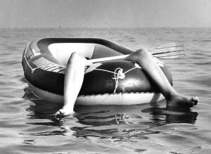Two legs in rubber dinghy, ca. 1980s